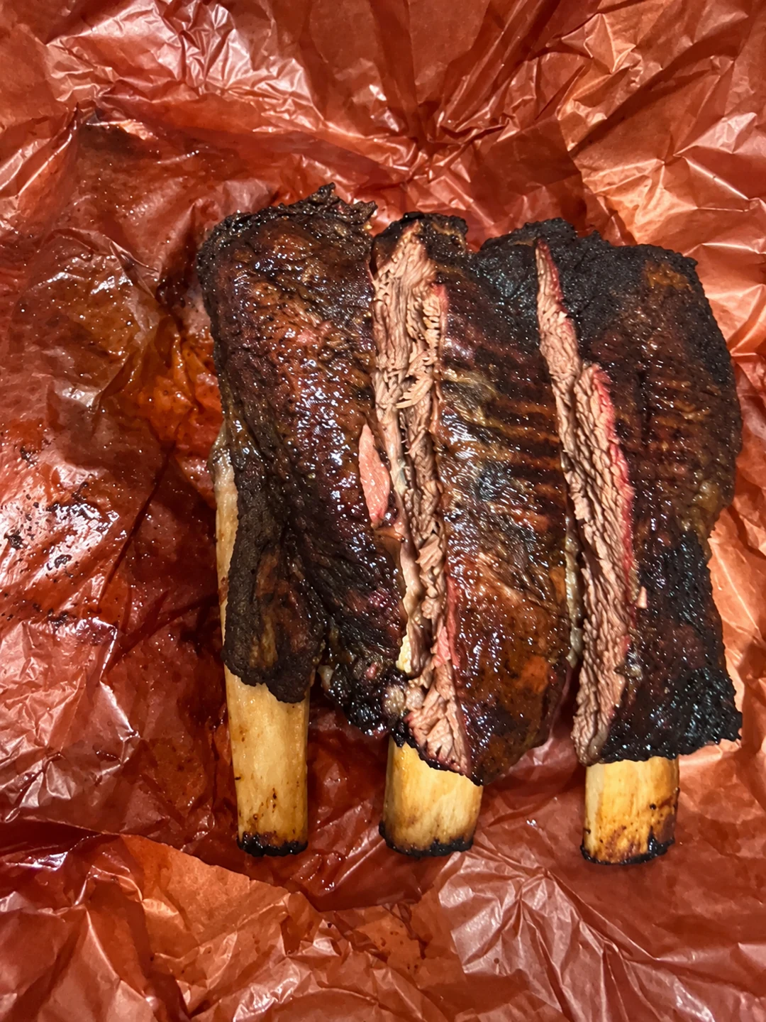Harper's BBQ smoked Dino beef ribs on butcher paper